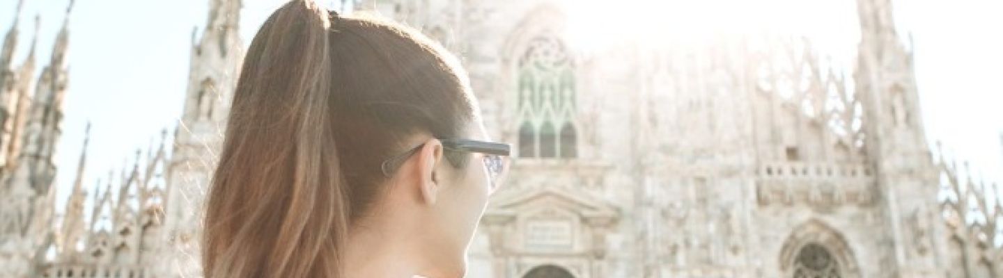 young woman in front of cathedral